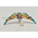 A WHITE METAL PLIQUE A JOUR HUMMINGBIRD BROOCH, the textured hummingbird, with circular cut ruby eye