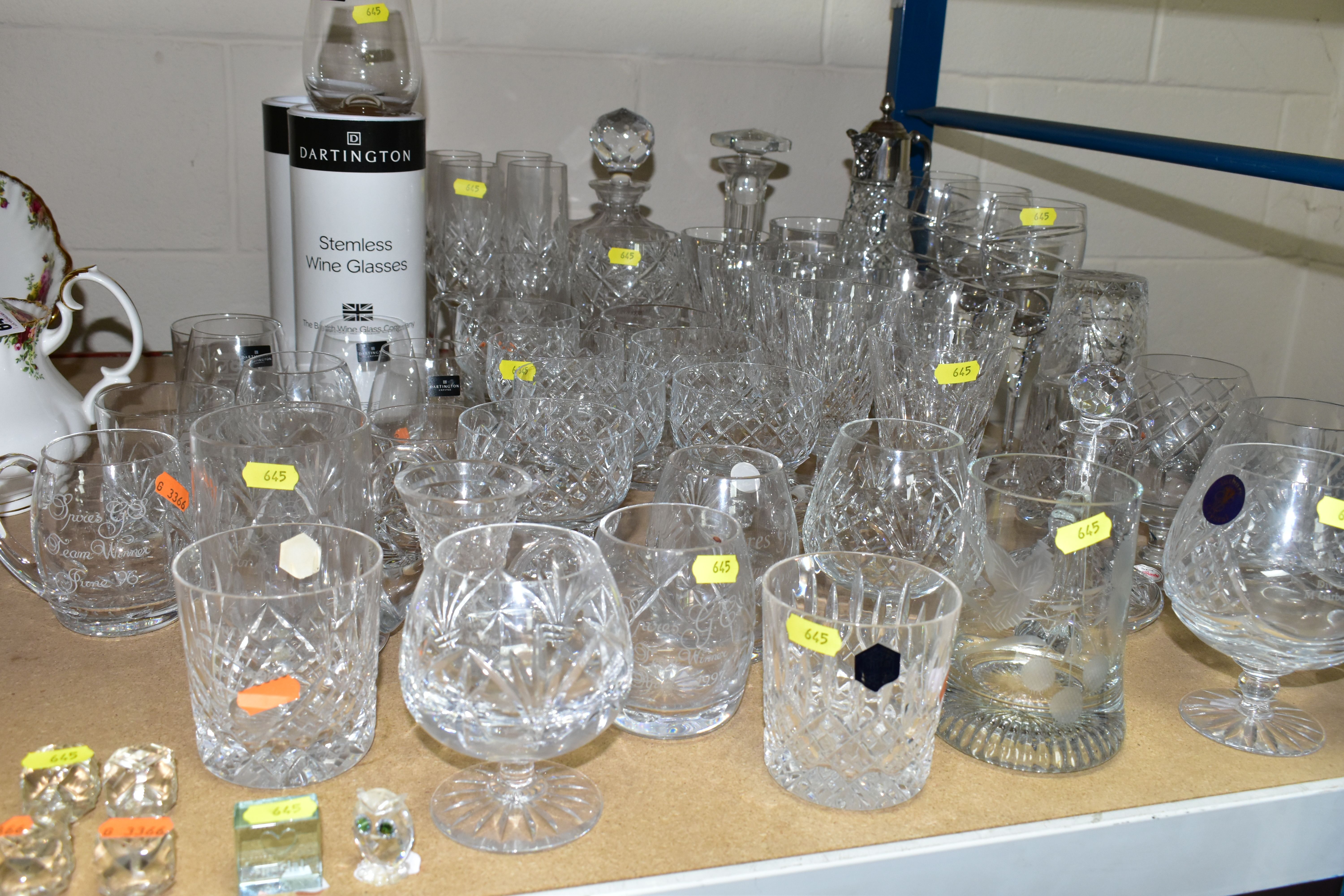 A QUANTITY OF CRYSTAL DRINKING WARE, to include four boxed Dartington crystal stemless drinking