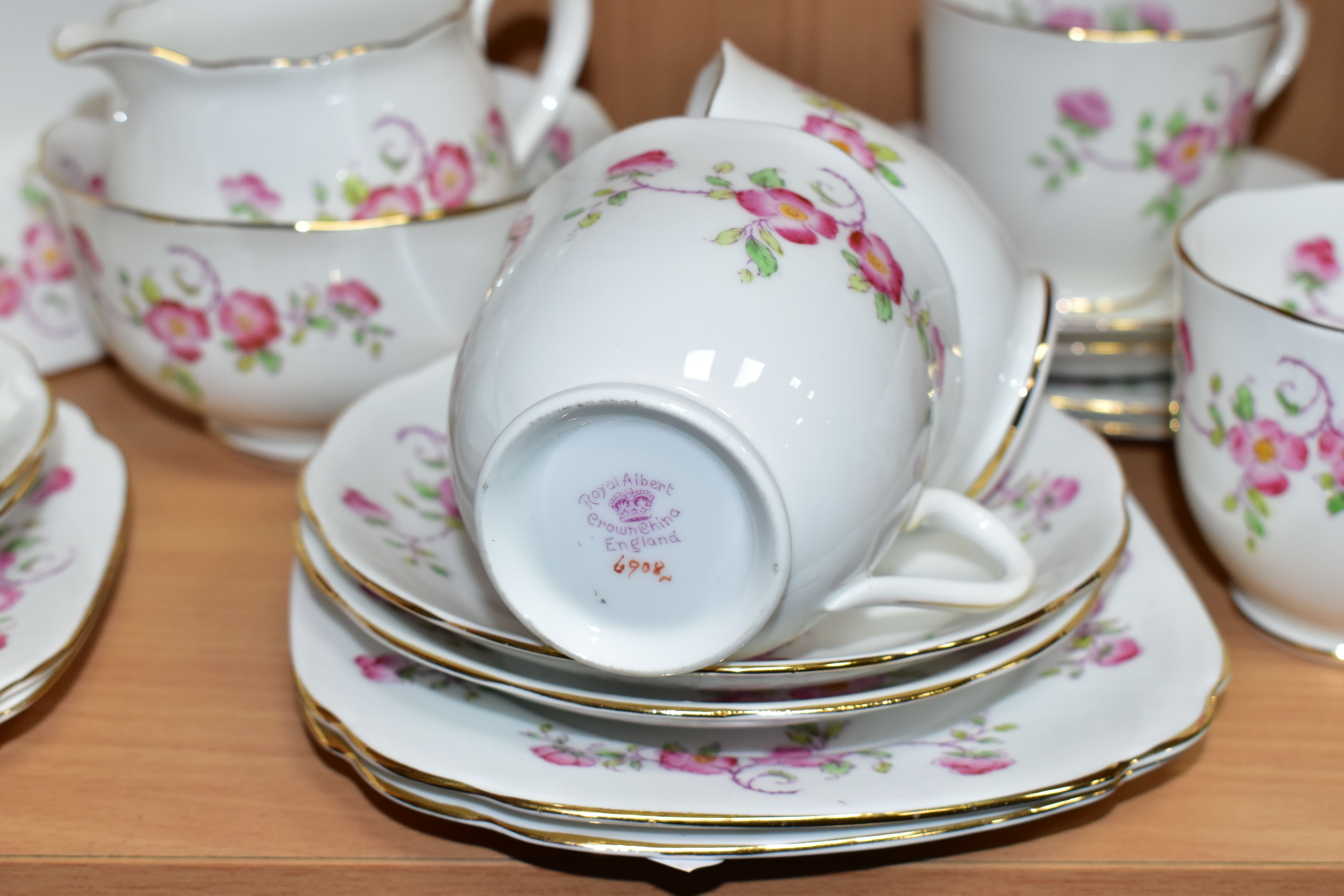 A TWENTY ONE PIECE ROYAL ALBERT WILD ROSE TEA SET, comprising a cake plate, a cream jug, a sugar - Image 2 of 3