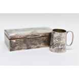 TWO EARLY 20TH CENTURY ITEMS OF SILVERWARE, to include a small embossed christening cup,