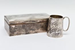 TWO EARLY 20TH CENTURY ITEMS OF SILVERWARE, to include a small embossed christening cup,