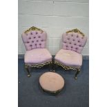 A PAIR OF LOUIS XV GILTWOOD CHAIRS, with heavy foliate decoration and buttoned pink upholstery,