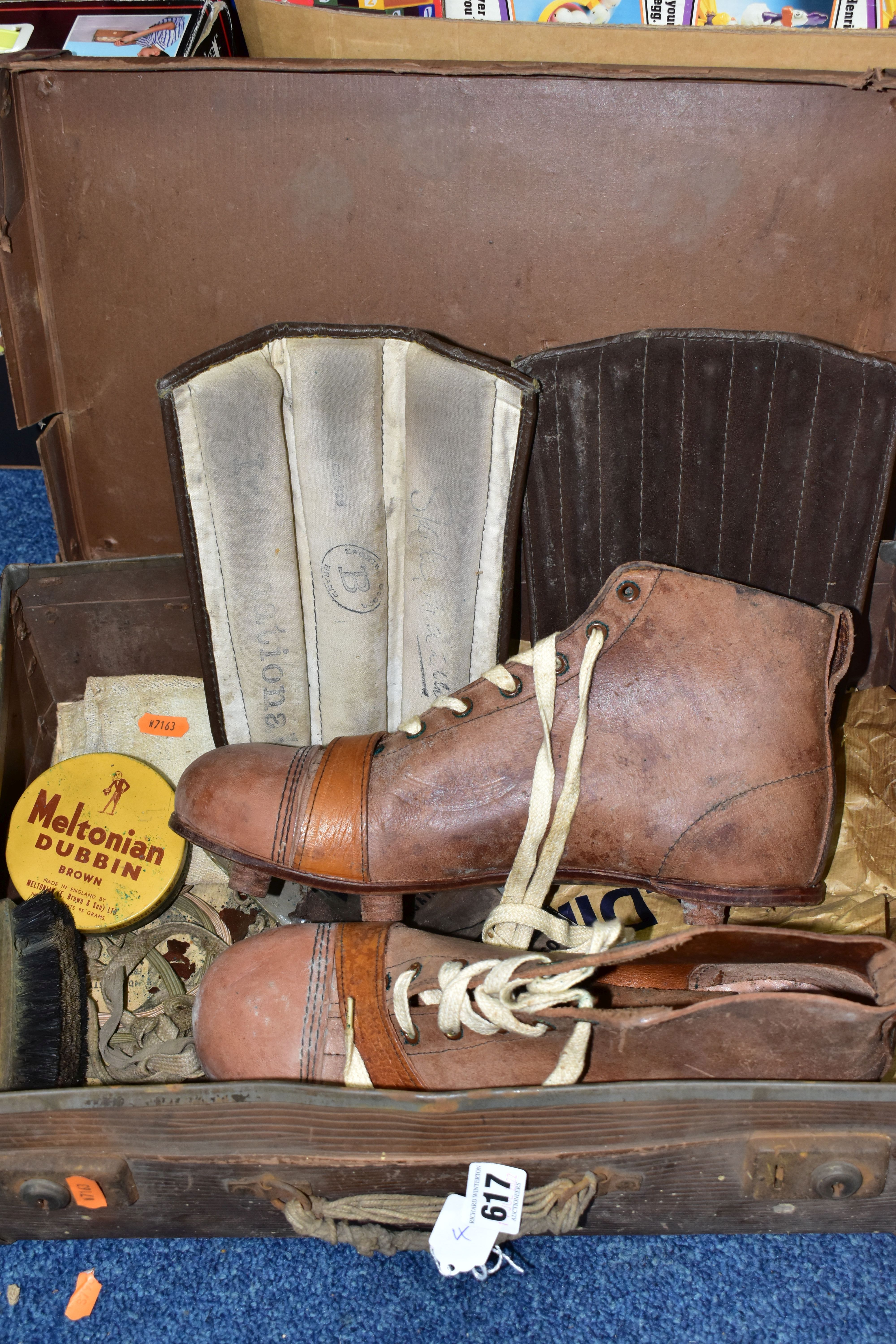 A PAIR OF VINTAGE LEATHER FOOTBALL BOOTS, size 9, together with a pair of vintage shin pads and