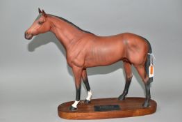 A BESWICK RACEHORSE FIGURE, no 1564, brown matt finish, on an oval wooden plinth labelled '