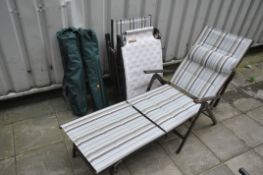 A PAIR OF PAGODA FURNITURE FOLDING SUN LOUNGERS, along with two folding camping chairs and a folding