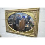 A MID TO LATE 20TH CENTURY FRENCH GILT FRAMED WALL MIRROR, with an oval plate 91cm x 66cm