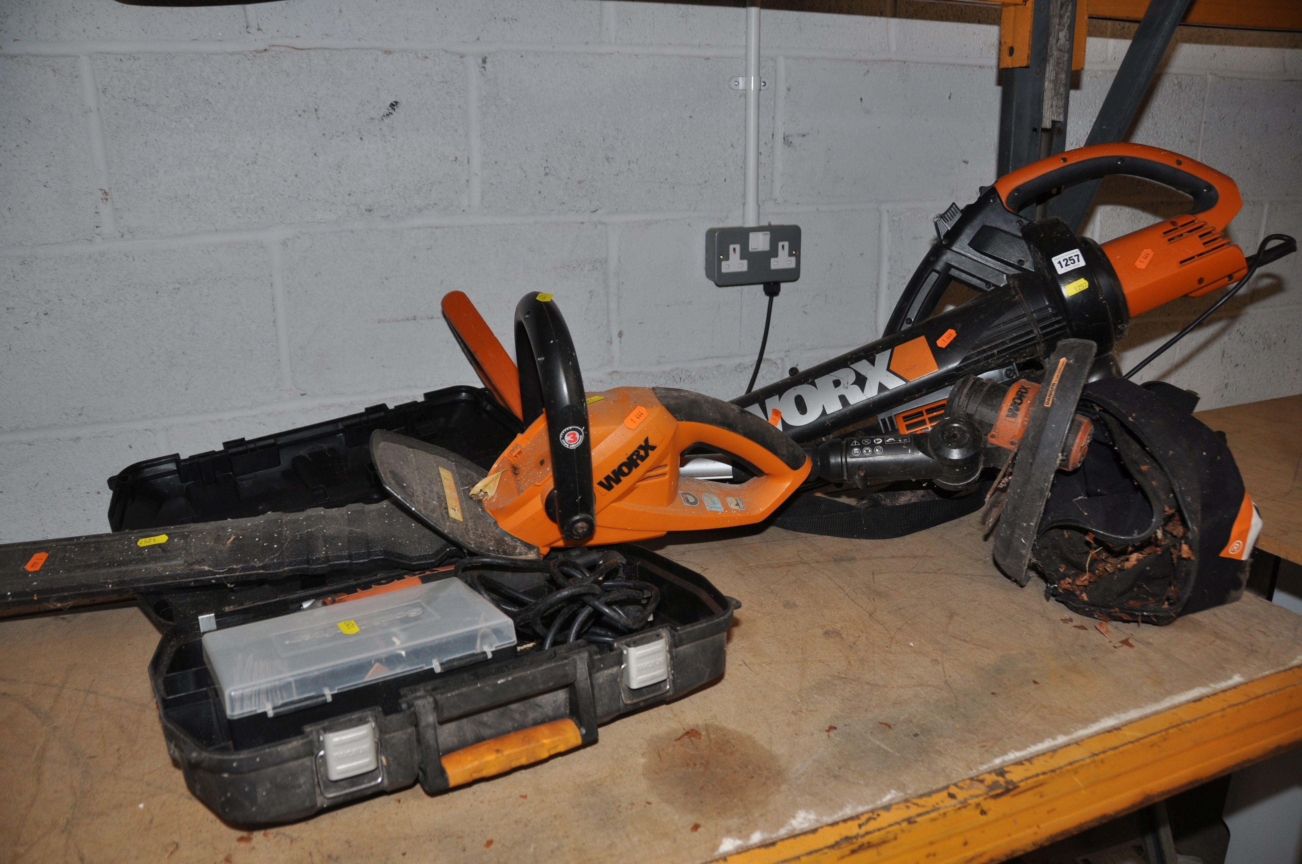 A COLLECTION OF WORX comprising a WORX WG250E.9 hedge trimmer, Worx WG151E.5 strimmer no charger (
