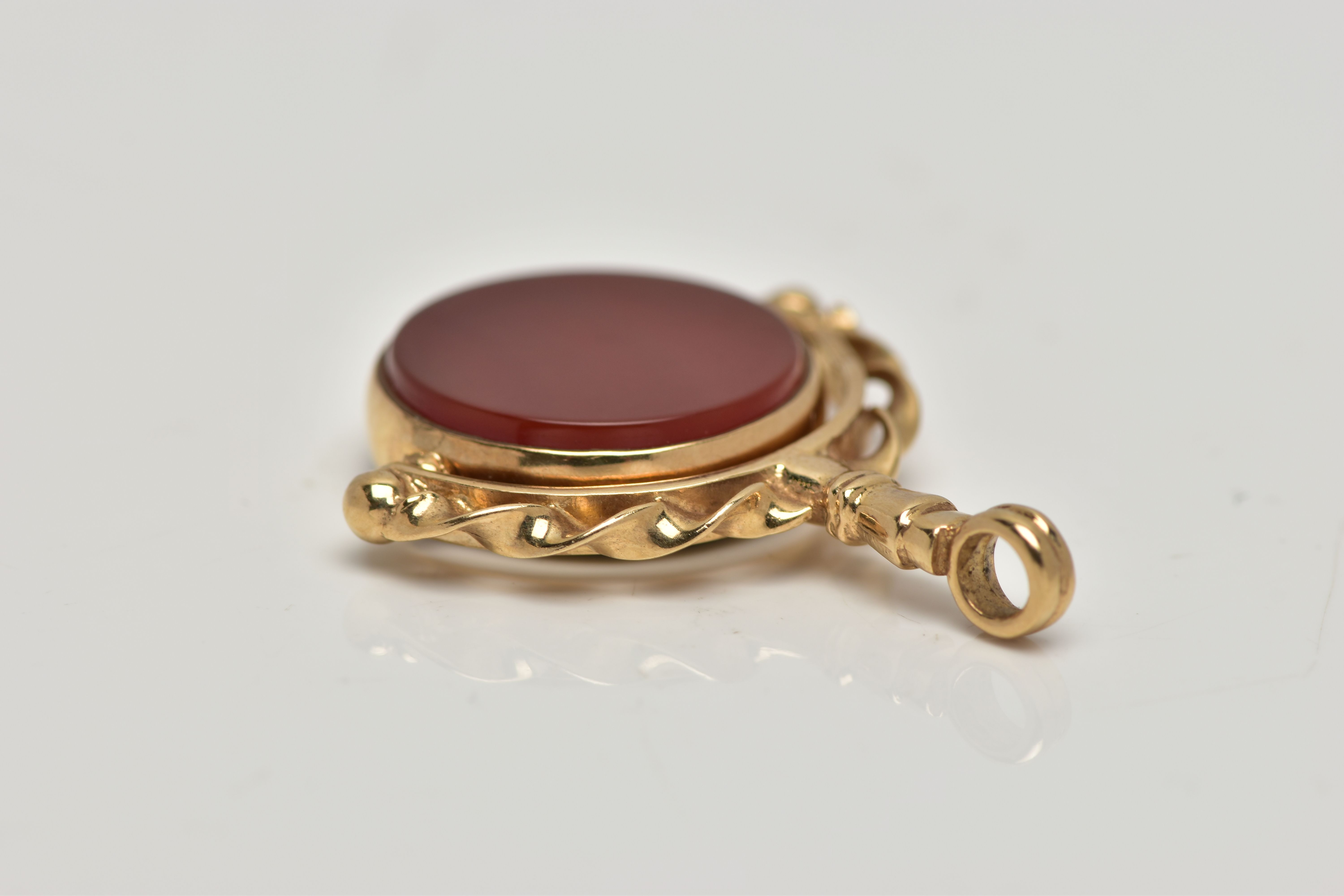 A 9CT GOLD HARDSTONE SWIVEL FOB, the bloodstone and carnelian circular panels, rotating to the - Image 4 of 4