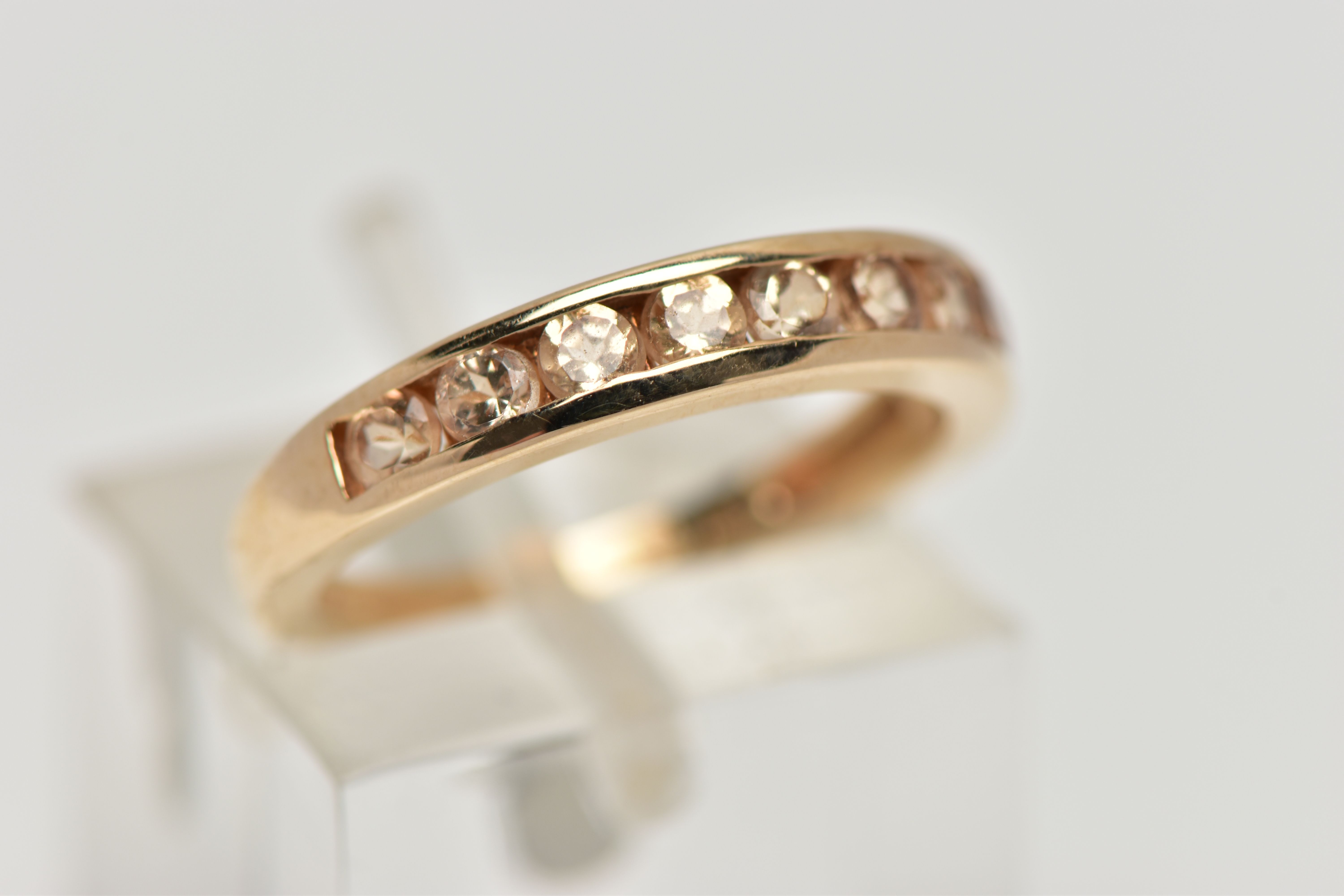 A 9CT GOLD GEM SET HALF ETERNITY RING, the circular shape peachy colour gems assessed as tourmaline, - Image 4 of 4