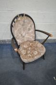 AN ERCOL STAINED ELM AND BEECH WINDSOR ARMCHAIR, with pink floral upholstered seat pads (condition -