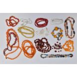 SEMI-PRECIOUS GEMSTONE AND PLASTIC BEAD NECKLACES, to include an oval carnelian bead necklace fitted