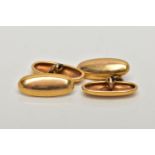 A PAIR OF YELLOW METAL CUFFLINKS, each of an oval polished dome, stamped 15ct partially worn maker