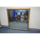 A LARGE 20TH CENTURY FRENCH STYLE GILT FRAMED WALL MIRROR, 143cm squared (condition:-missing light