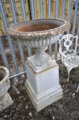 A LARGE CAST IRON CAMPAGNA GARDEN URN, of a shallow form, on a separate plinth support, diameter