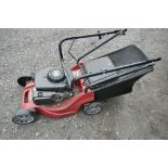 A MOUNTFIELD PETROL LAWNMOWER, with grass box (condition:-untested, but engine turns)