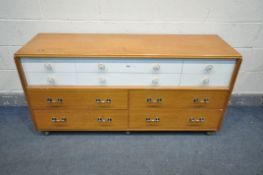 A MID CENTURY G PLAN TEAK SIDEBOARD/CHEST OF TEN ASSORTED DRAWERS, on casters, length 150cm x