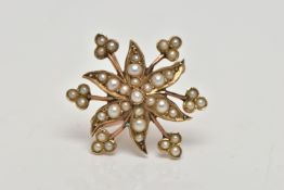 A YELLOW METAL BROOCH/PENDANT, in the form of a flower, set with split pearls, fitted to the reverse