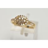 A 9CT GOLD DIAMOND RING, cluster design of an oval form, set with round brilliant cut and