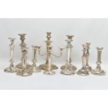 A BOX OF ASSORTED WHITE METAL CANDLE STICKS, eleven candle sticks of various styles, all with