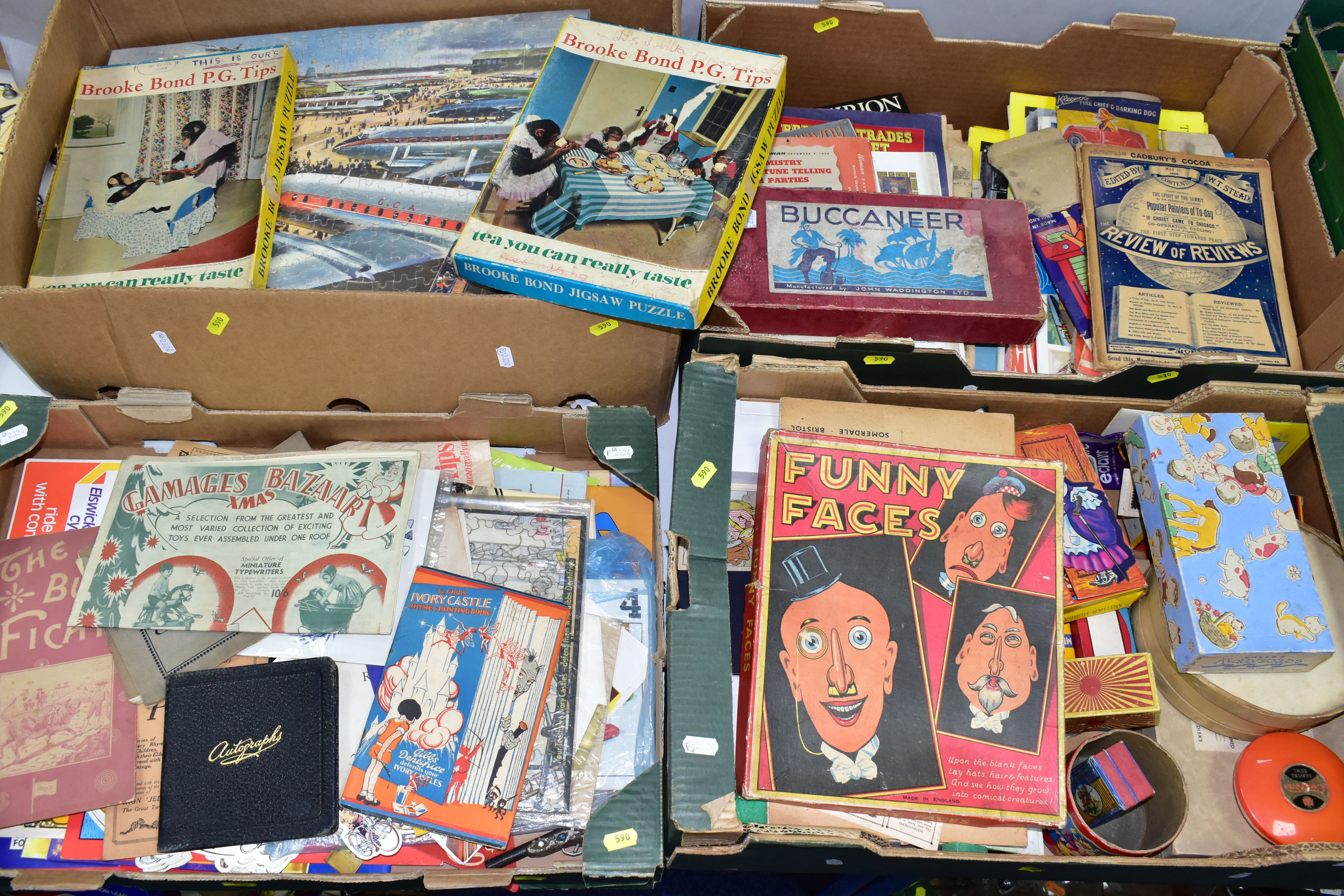 FOUR BOXES OF 1920S CHILDREN'S BOOKS, GAMES AND JIGSAWS, consisting two Brooke Bond P.G Tips