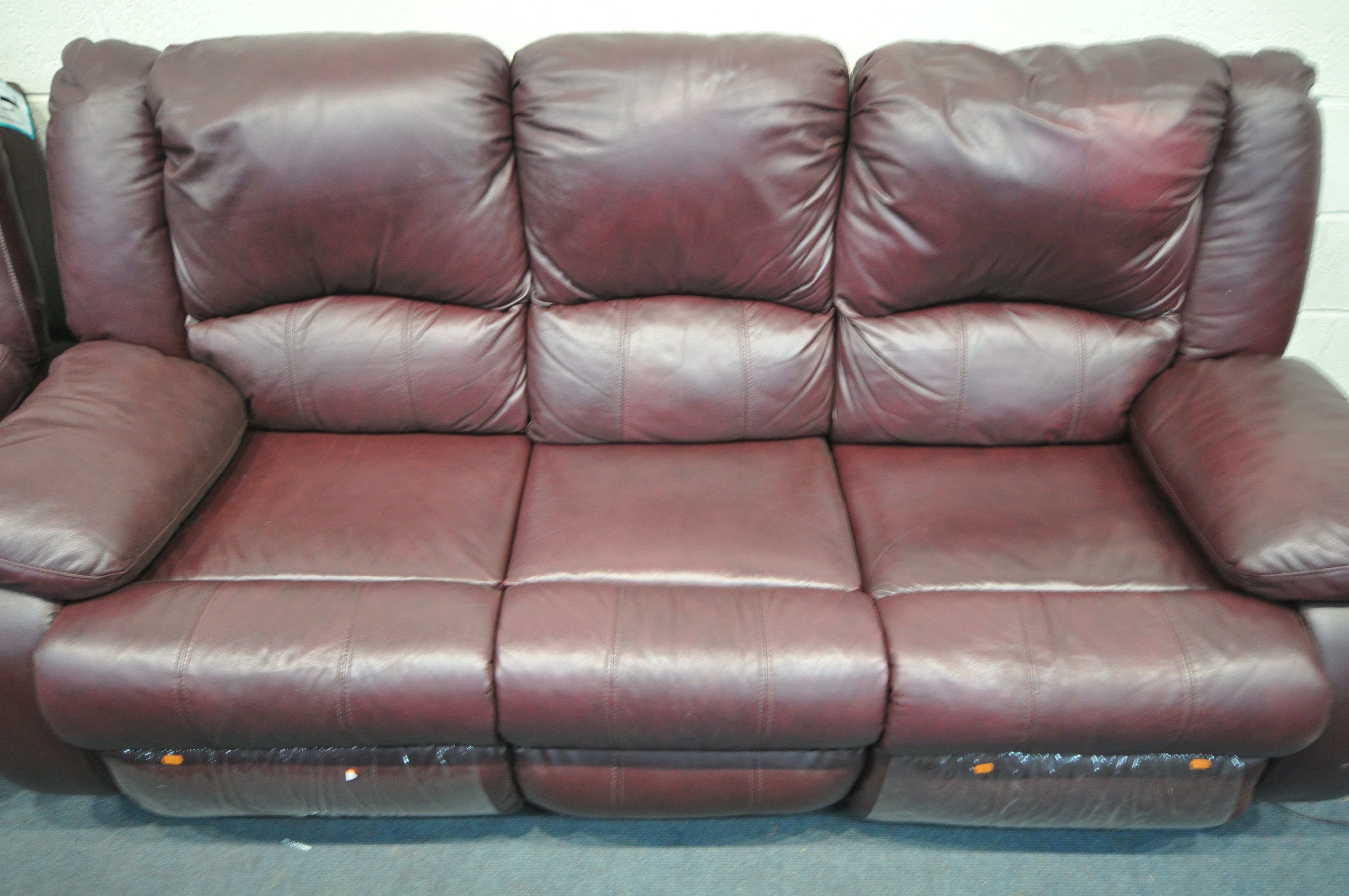 A PLUM COLORED LEATHERETTE THREE SEATER MANUAL RECLINING CHAIR, along with a matching rocking - Image 2 of 3