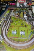 A OO GAUGE MODEL RAILWAY LAYOUT, double track oval with branches which form a near triple track oval