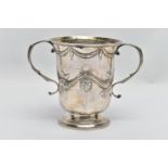 A GEORGE III SILVER LOVING CUP, bell shape body with embossed and chased floral and swag design with