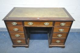 AN EARLY 20TH CENTURY MAHOGANY KNEE HOLE DESK, with green tooled leather inlay, nine assorted