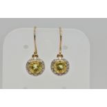 A PAIR OF YELLOW METAL GEM SET EARRINGS, each designed with a circular drop set centrally with a