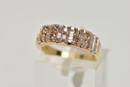 A 9CT GOLD, DIAMOND HALF ETERNITY RING, designed with five sections each set with two brown round