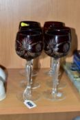 A SET OF SIX RUBY FLASH CUT HOCK GLASSES, on a tapering hexagonal stem with cut edges, circular foot