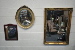 A GILT FRAME BEVELLED EDGE WALL MIRROR, 105cm x 74cm, a gilt framed oval wall mirror with foliate
