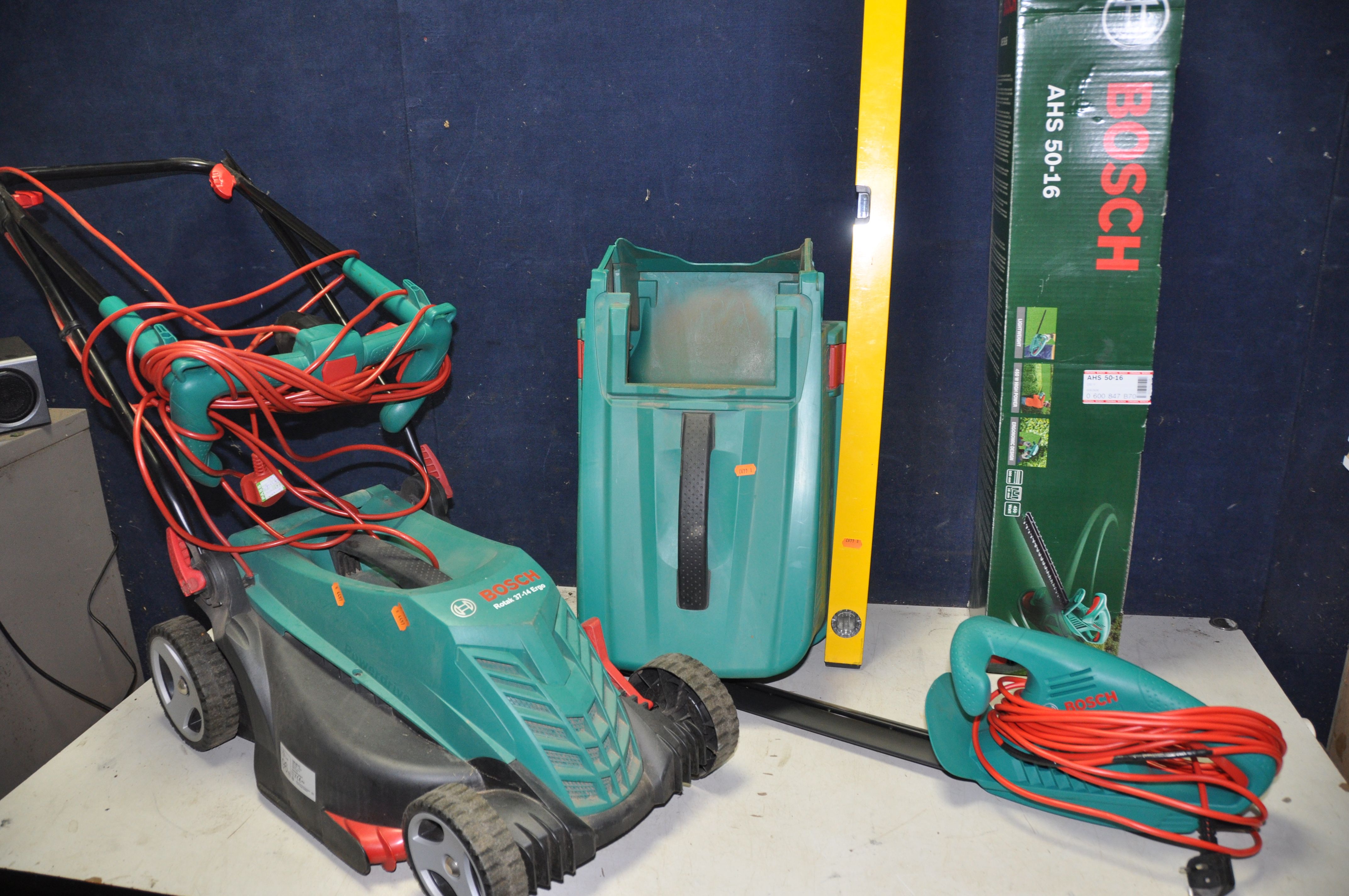 A BOSCH ROTAK 37-14 ERGO LAWN MOWER with grass box along with a Bosch AHS50-16 electric hedge