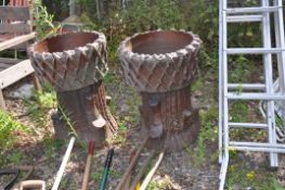 A PAIR OF TREACLE GLAZED GARDEN PLANTERS with a round lattice top 50cm in diameter and tree stump