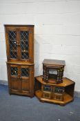 AN OAK LEAD GLAZED CORNER CUPBOARD, width 69cm x depth 40cm x height 172cm, an oak corner cabinet