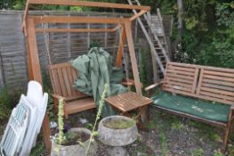 A MODERN HARDWOOD GARDEN SWING with cover (frame 162cm wide), a similar garden bench, folding