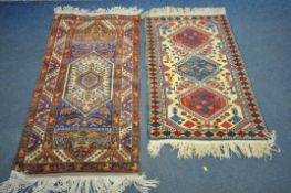 A 20TH CENTURY TURKISH KAZAK RUG, with a cream field, and triple medallions, 126cm x 81cm, and a