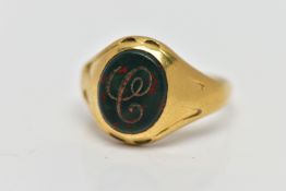 AN 18CT GOLD SIGNET RING, set with an oval bloodstone insert with an engraved initial 'C', worn
