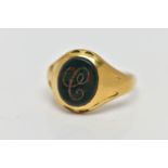 AN 18CT GOLD SIGNET RING, set with an oval bloodstone insert with an engraved initial 'C', worn