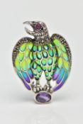 A PLIQUE A JOUR, RUBY AND AMETHYST BIRD BROOCH/PENDANT, the bird of prey with ruby set eye detail,