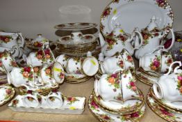 A ROYAL ALBERT 'OLD COUNTRY ROSES' PATTERN PART DINNER AND TEA SERVICE, comprising twelve teacups,