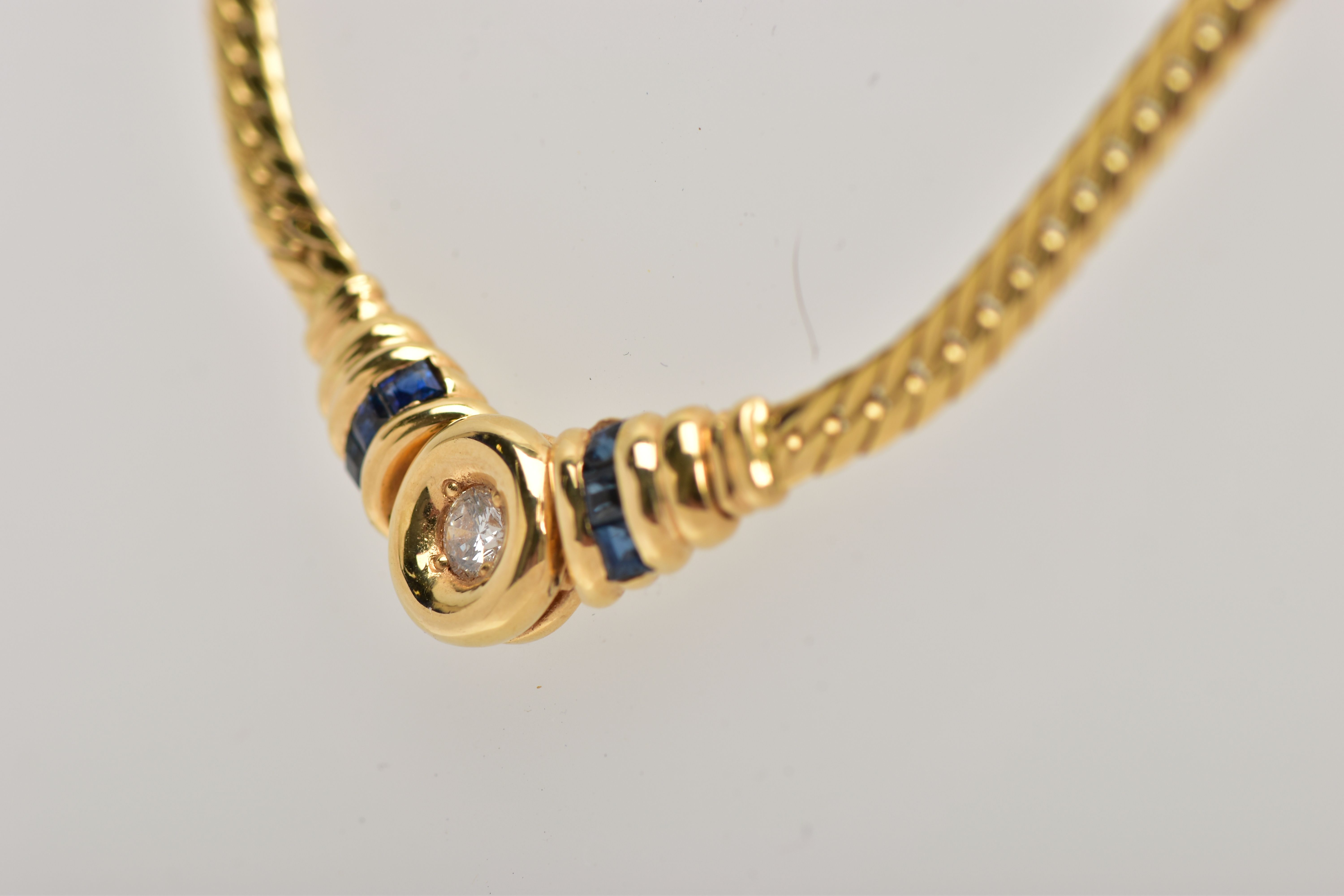 A YELLOW METAL DIAMOND AND SAPPHIRE NECKLACE, an articulated flat link chain fitted with a claw - Image 4 of 4