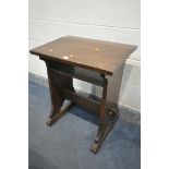 A 20TH CENTURY OAK CHILDS DESK, on trestle legs, united by a single stretcher, width 62cm x depth