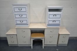 A CREAM FOUR PIECE BEDROOM SUITE, comprising a dressing table with six drawers, length 139cm x depth