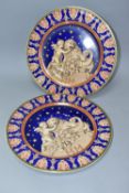TWO ROSENTHAL FOR VERSACE CHRISTMASTIDE 2000 PLATES, depicting a cherub, lion and cornucopia