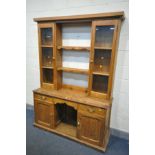 A 19TH CENTURY PINE DRESSER, the top with a two glazed cupboard doors, flanking two shelves, over