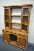 A 19TH CENTURY PINE DRESSER, the top with a two glazed cupboard doors, flanking two shelves, over