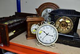 A COLLECTION OF FIVE CLOCKS, to include a late 19th century black slate mantel clock, made by