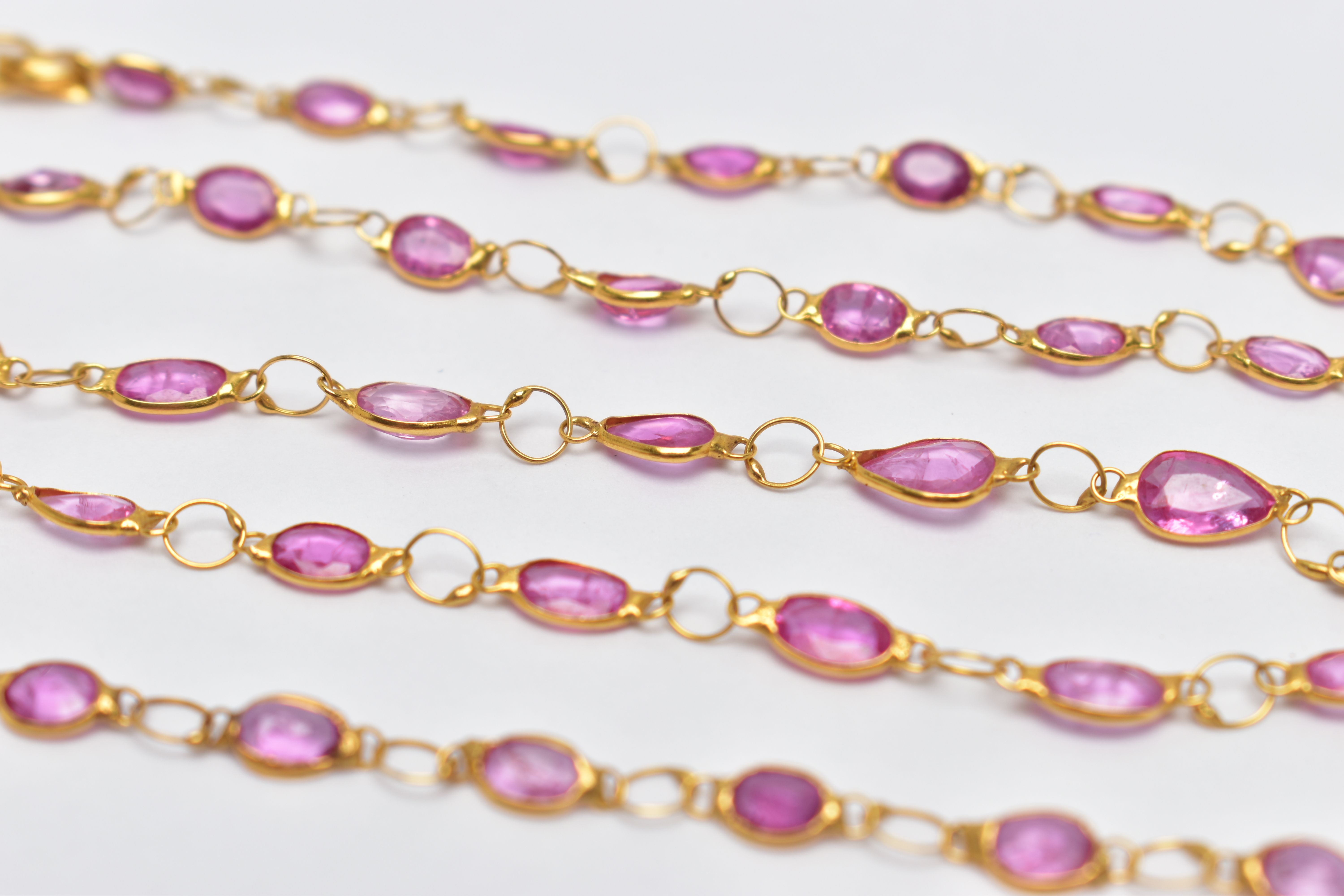 A YELLOW METAL, SAPPHIRE SPECTACLE SET NECKLACE, comprised of forty three mixed cut pink - Image 2 of 3