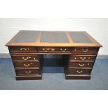 A HARDWOOD PEDESTAL DESK, with triple black leatherette writing surface, and an arrangement of